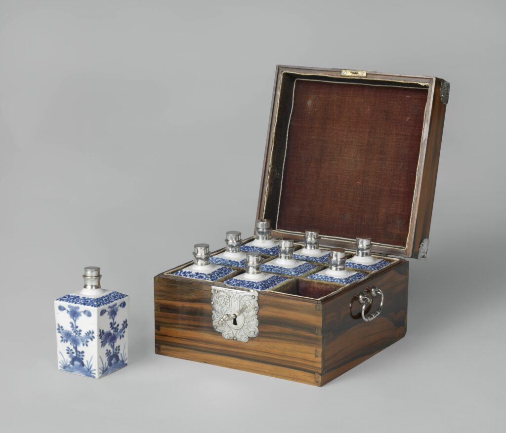 Open box holding blue and white bottles with silver caps